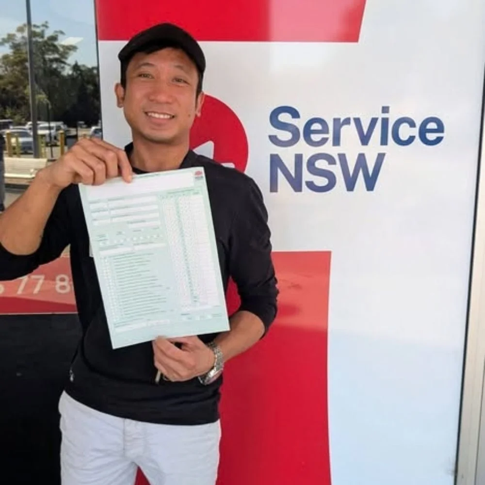 a guy holding green p word card